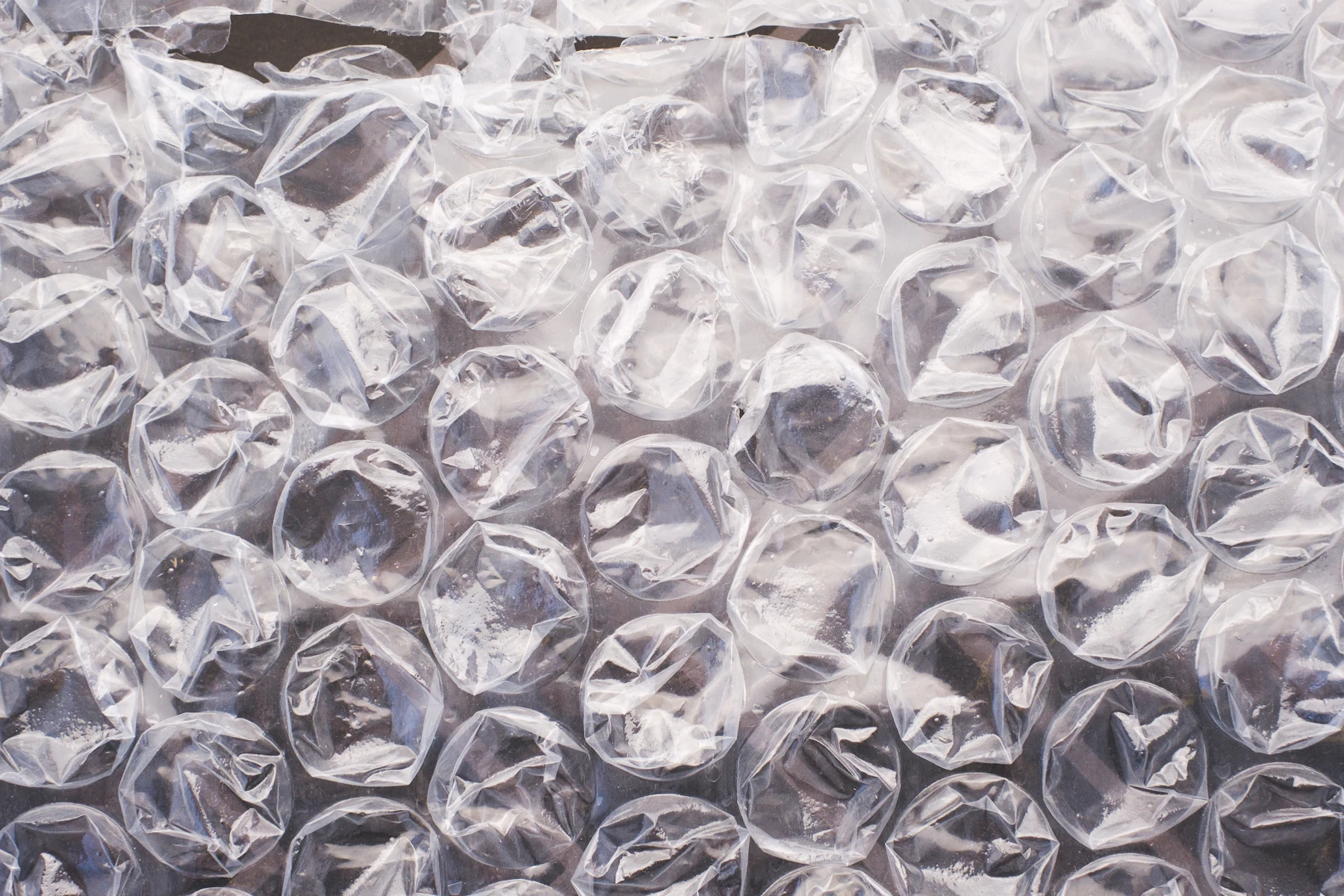 Packing guide, restricted items and FAQs Close-up of clear plastic bubble wrap packaging material
