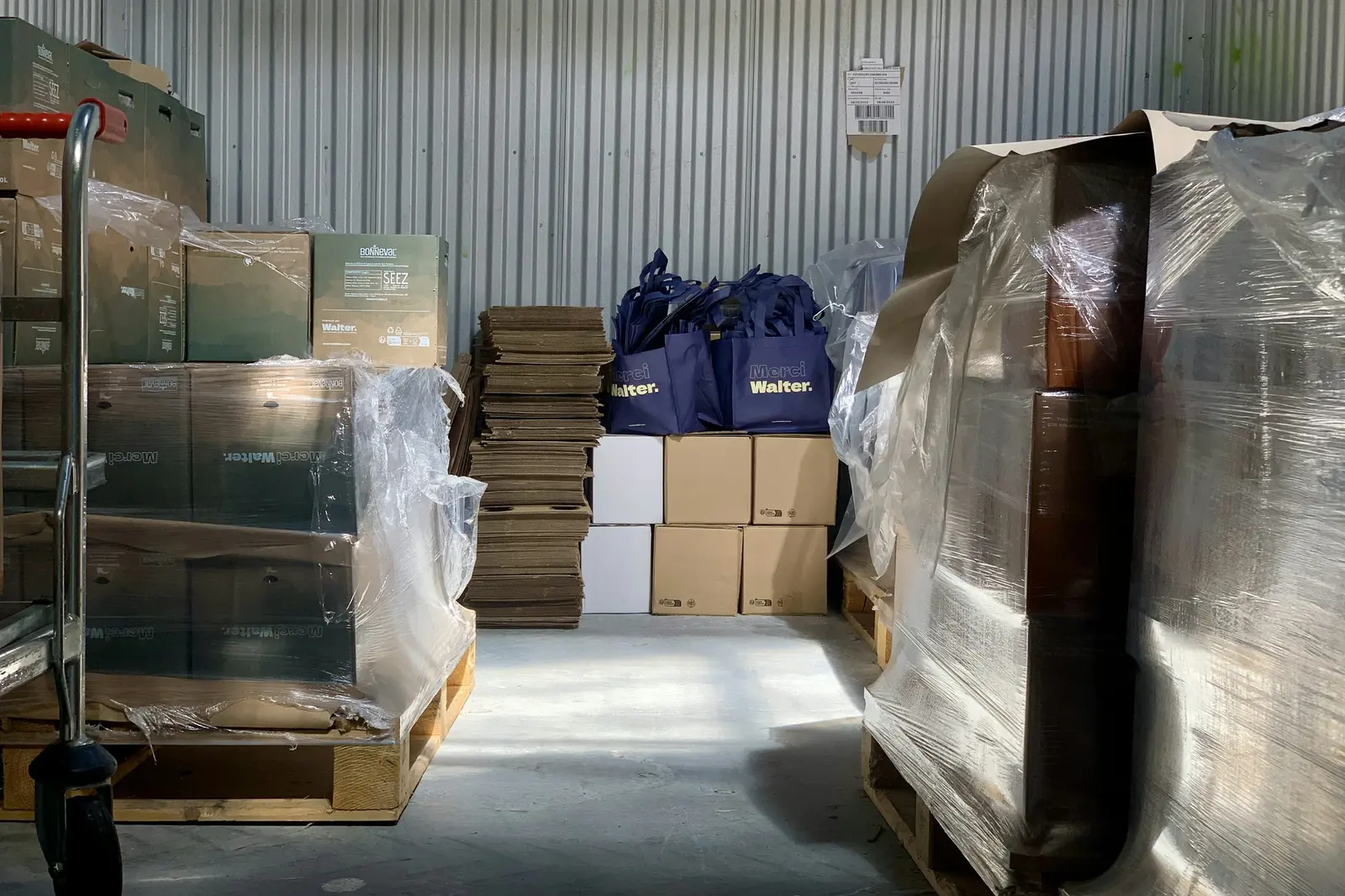 Home Palletised boxes and bags inside a freight warehouse
