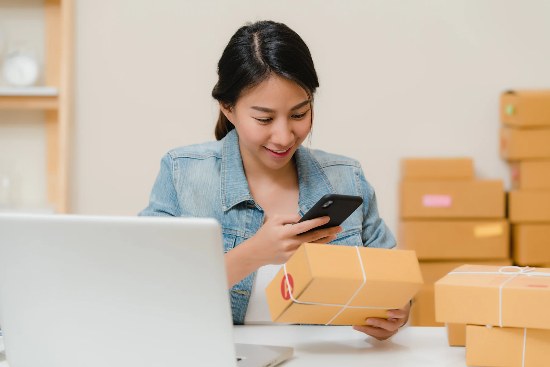 Parcel checking beside a laptop — illustrative service photograph