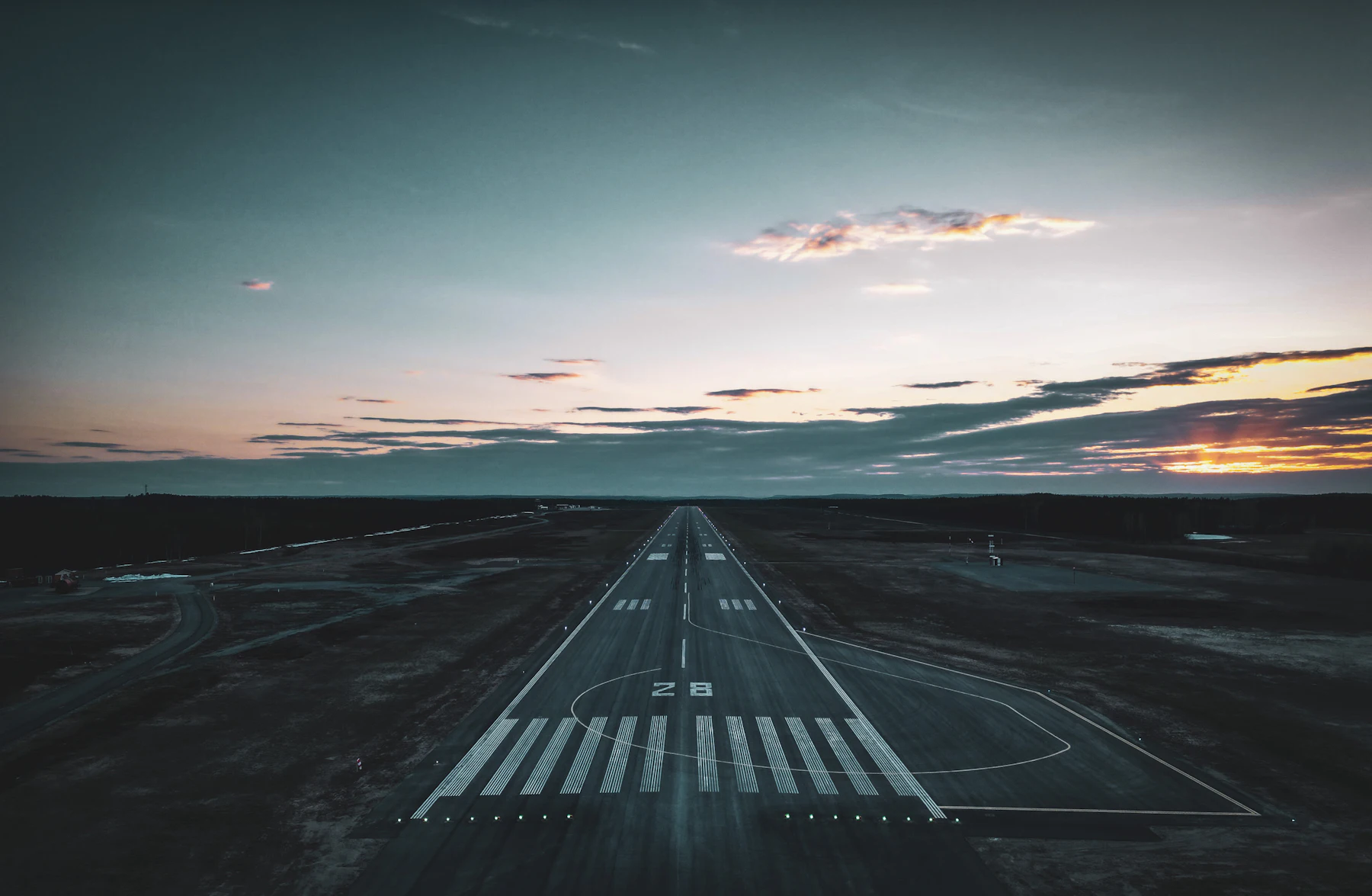 International Repatriation Empty airport runway and taxiway under a calm evening sky